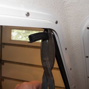 I pulled out the rubber "stopper" material and shortened it a couple of inches top and bottom using tin snips.