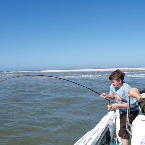 Brad, Guide Charles' grandson, hooks up with his first redfish!