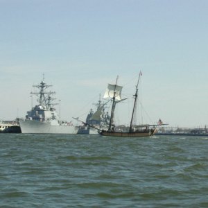 The old and the new.  A schooner returning from the great Schooner Race - Annapolis to Portsmouth Va. and DDG 51's at Norfolk Naval Base