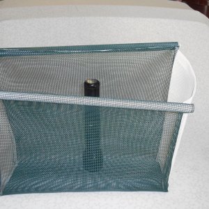 I credit my wife for introducing me to a fabric called "vinyl bag mesh". It is all plastic, mildew proof, machine washable, easily sewn, doesn't ravel, and is available in many colors.  The green matches my boat perfectly.