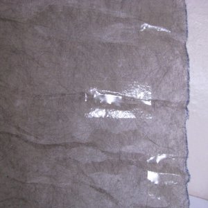 03 Contact Stik glue sheets are very thin and transparent.  It adheres very well to the surface.