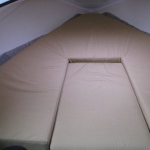 06 Berth Cushion in place.  Please note we cut the HyperVent 6 inches in circumferance larger than the Berth cushion to allow the Hypervent to extend up the sides.  IMPORTANT UPDATE JULY 2012.  We had to cut the excess hypervent material to just fit the berth cushion's dimensions after several restless nights sleeping.  We found that the original configuration caused the berth cushion to curl up slightly along the sides, forcing us to sleep in the middle.  The manufacturer's instructions were right!  We now sleep soundly, with no condensation underneath the cushion.