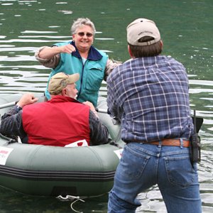 Jim lends a helping hand to Denny and Signe landing their dingy.