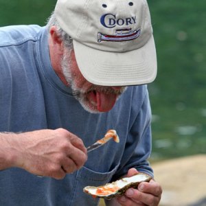 Tom enjoying a oyster.