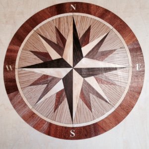 Inlay is 1/8\" thick mounted on a piece of 3/8 marine plywood. It is made of 4 different types of exotic hardwood.