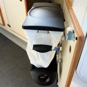 It fits nicely on the inside of the galley door