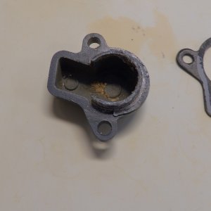 The thermostat and the cover had some build up.  Good thing I was careful removing the gasket, as the new thermostat did not come with a new gasket.