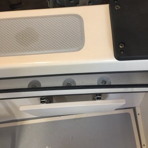 3 bolts with large washers hold the seats on.