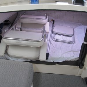berth protection with HD plastic shower curtain, replaced each season.  Now using lightweight aluminum folding 'directors chairs' with foldout table