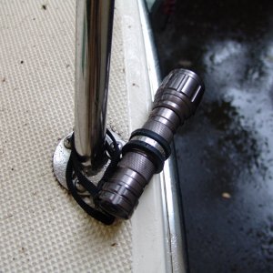 Media 'A 1" rubber covered stainless clamp from West Marine holds them in place using an existing bolt. The supplied lanyard hangs on as well in case something breaks.' in album 'I got these led lights from Sam's Club in a 2 pack for $29.00. 3 AAA batteries each (provided).'