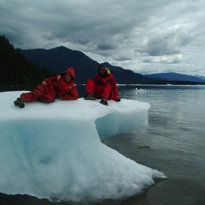 NIck and David ON some cool ice!  OK, it is not safe to be climbing around on ice bergs, they may roll.  This one is actually grounded, I am photographing from the beach!