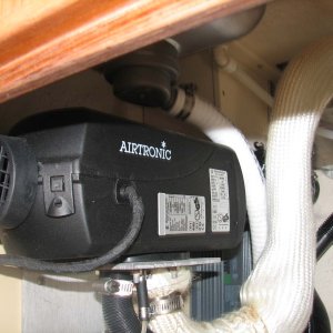 Espar Heater on forward wall of galley cabinet