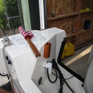 Flag pole slides in to square tube with dowel stopper.