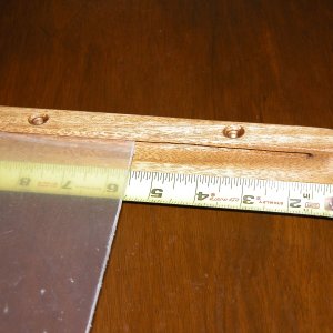 The guides for the plexiglass stop abt 1/2" from each end of the 9" guides. The above pix is the bottom support guide.