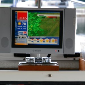 LCD-TV-in-Daytime-Light in operation: I found an inexpensive but very rugged mount and raised it slightly so that it stows flat on a rubber mat for shock protection.