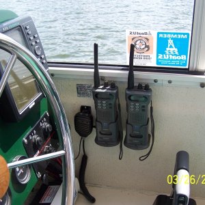 I have 2 hand held radio's and have mounted the charging brackets in the helm next to the on board vhf radio mic.  They are wired in to stay charged