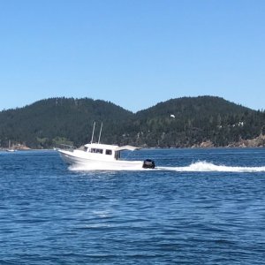 Photo of Big-C caught by Sean (C-Brat member "spd") running alongside in his Venture 23 on our way to Anacortes! On this trip we had a boat load of 4 full grown men, so running pretty heavy!