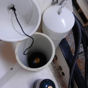 Each lid has a string attached to the second of the canisters to allow lifting it up from the bottom of the tube