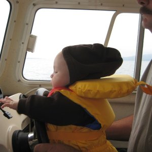TR steering Paka's boat