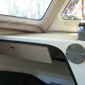 Stove mount with locking storage drawer to the left.
