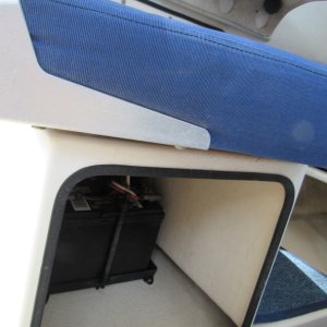 Battery in passenger seat pedestal