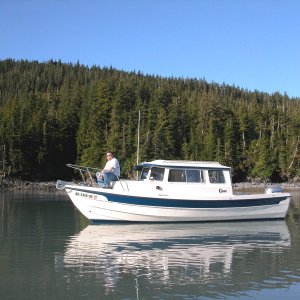 (AnchortownJim)My buddy Bill on the bow in Pigot Bay, PWS, 6/19/04