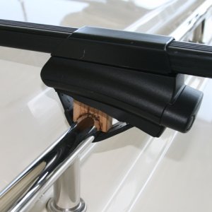 Close up of Thule CrossRoad tower with wood spacer for clearance of cabin roof