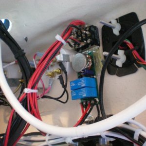 Intermittent wiper circuit board.  Switch and potentiometer protrude through the console (and secure the circuit board).  The two blue components are the relays- one for each wiper.