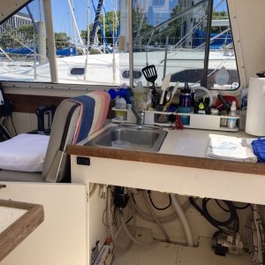 helm / galley with storage - hot water heater removed for max space (plumbing is still intact)  we use JetBoil Genesis system