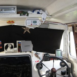 Blackout curtains and dash layout.   You can just make out "Gord" our guide frog on the electronics shelf. One needs a pet and he works cheap. Also my micronesian star chart from my buddy Winston for good navigation luck