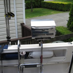 new Magma bbq  Trailmate model smallest they make new model lpg 1 lb bottles  clamps to ladder either inboard like this or overboard.  no holes and off in 30 seconds for boarding