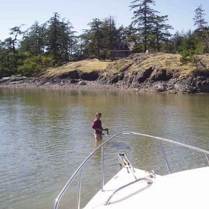 Anne demonstrating shallow water anchoring techniques