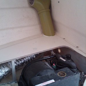 another view of AC with PVC pipe exposed duct and grille (replacement shower strainer)