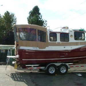 Factory shots of the Mis Dee canvas being fitted to the Lucky Fin