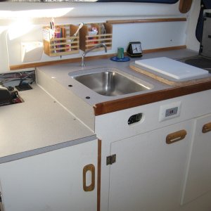 with backrest removed & seat cushing being used as cushion on ice chest, there is now room to prepare gourmet seven course meals (beans & franks)