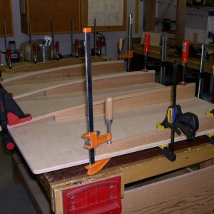 Making homemade floorboards from epoxy saturated 1/2in baltic birch plywood and cedar supports.  Painted with marine non-skid paint.