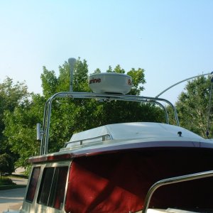 Tall stainless steel radar arch with radome, VHF antenna, and GPS antenna