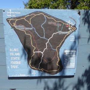 Setting out to hike around the island, trail map posted by the marina.