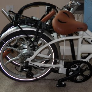 I am assuming that I won't need a dinghy because my boat is the size of a dinghy.  What might be nice is a grocery getter on shore.  This is a folding bike, not unusual for a boat.  What is unusual is that it is electric.  20 mph and a 30 mile range.  48# including battery.