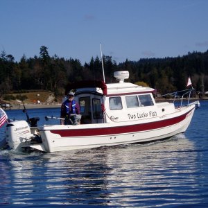 Mac, rigging for fishing on Two Lucky Fish.(Robbi)