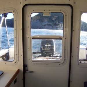 Rear door with sliding window and screen.