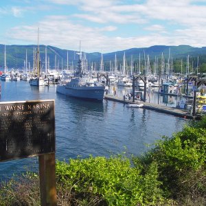 John Wayne Marina with active duty Navy Ship, the Olympic Venture, (Submarine tender) moored at entrance float.