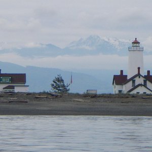 New Dungeness Lighthouse on Dungeness Spit, 7  mile long worlds longest natural sand spit, with the Olympic Mountians in the background.