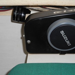 Mounted it on an angle on the outboard side of the throttle mount.  It's out of the way and yet handy when needed.