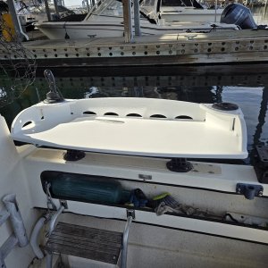 Burnewiin table can be mounted on the side (which allows the motor to be in the full upright position) or the motorwell in the back