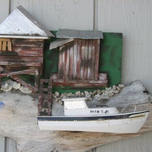 6/29/2012  A carved model of my old 22' CD.
Carved in Beaufort, SC. My brother sent it for my birthday several yrs. ago.
Boat is about 14" long.