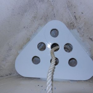 Shelf sits on cleats.  It has been thoroughly epoxy coated, then painted. Has holes for drainage.  Bitter end of rode tied off below.