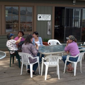 The girls relax on the dock of the Wheeler Island Duck Club.