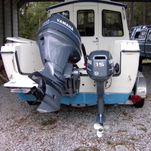 Tight fit, good power. Rope start, charges batteries. Running from out back is great.Kicker mounted before Mini Jacker or trim tabs.