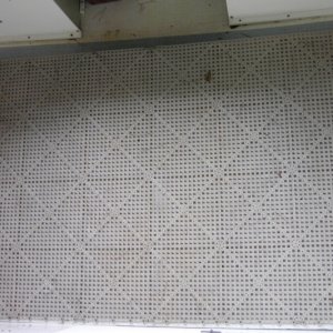 Simple cheap plywood deck. Room under splash well for coolers and gear.  Can still see for water build-up in stern